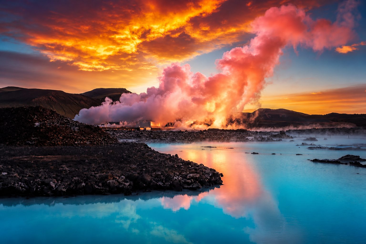 Pink steam over a turquoise lagoon at sunset